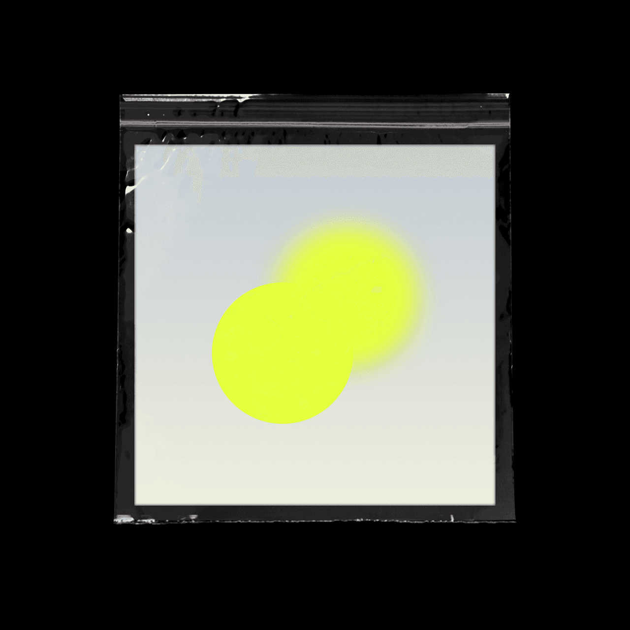 Two bright yellow circles overlaps on blue pastel background. One is sharp, the other one has a gaussian blur on it.